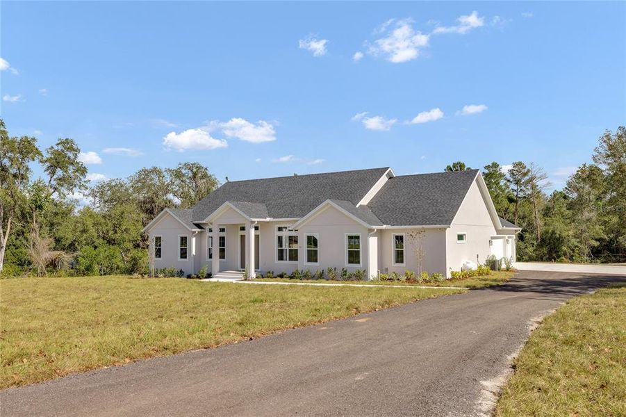 Front exterior of a new home in , Debary, FL, highlighting curb appeal (Image 28). Front exterior of a new home in , Debary, FL, highlighting curb appeal (Image 28).