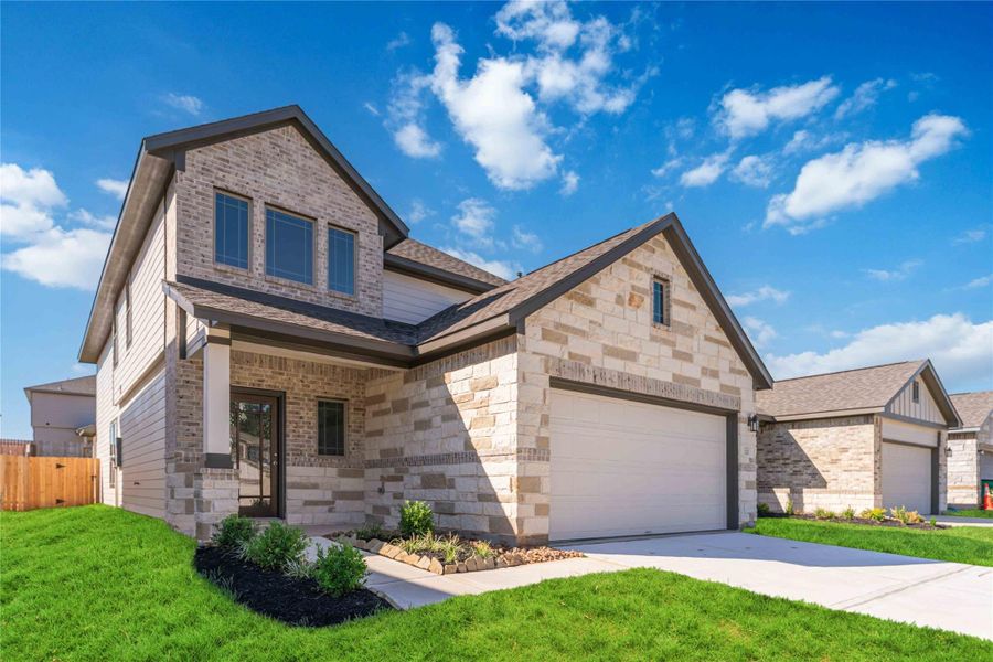 Front exterior of a new home in Magnolia Springs, Montgomery, TX, highlighting curb appeal (Image 2).