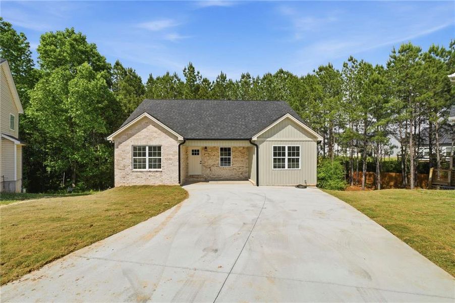 Front exterior of a new home in , Calhoun, GA, highlighting curb appeal (Image 1). Front exterior of a new home in , Calhoun, GA, highlighting curb appeal (Image 1).