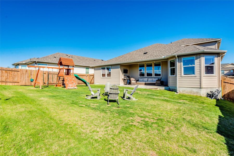 Back yard and covered patio.
