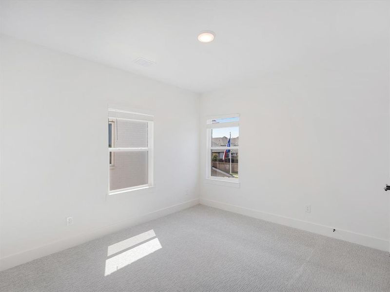 Spacious, unfurnished interior of a new home in Royal Court, Little Elm (Image 16).