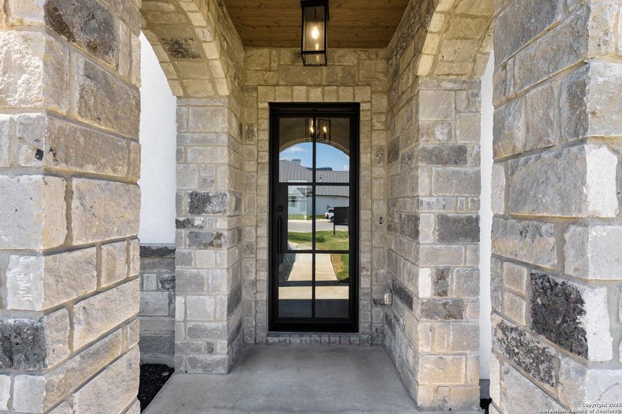 Exterior details and patio area of a home in , Castroville (Image 3).