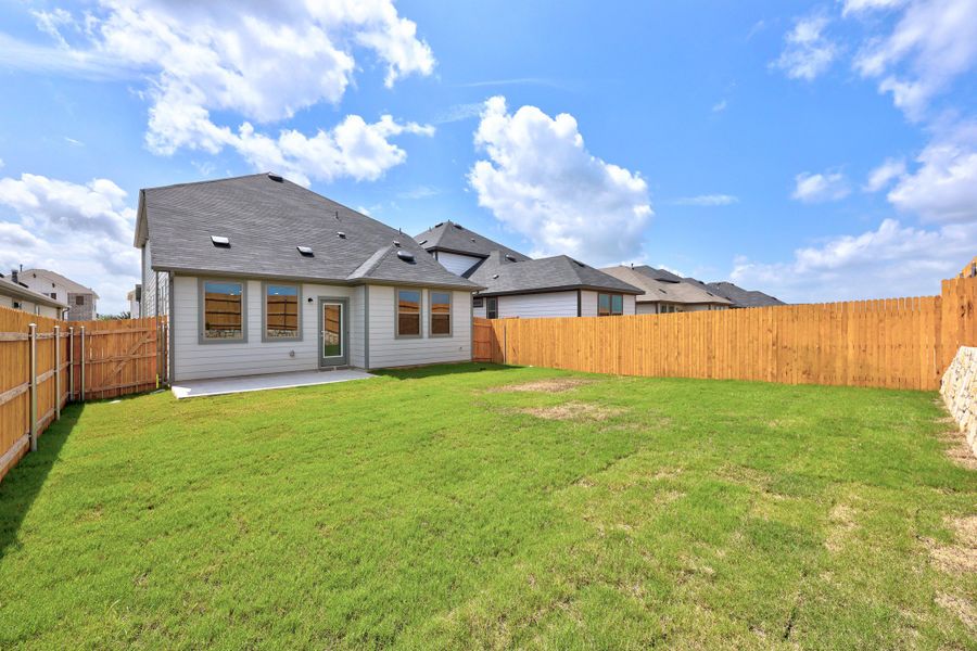 Exterior details and patio area of a home in Trinity Ranch, Elgin (Image 21).