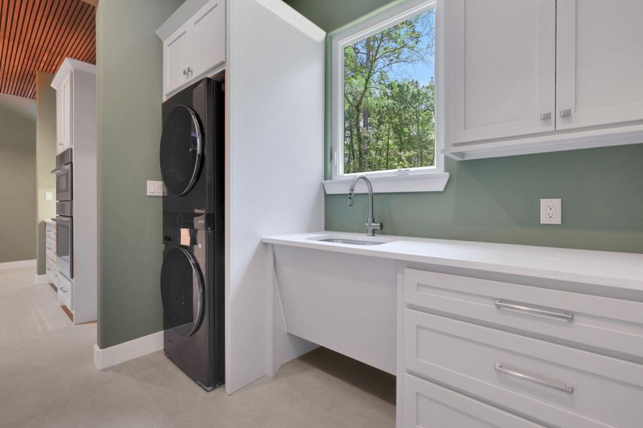 Bright and functional - the laundry room sink offers a sloped entry for easy use