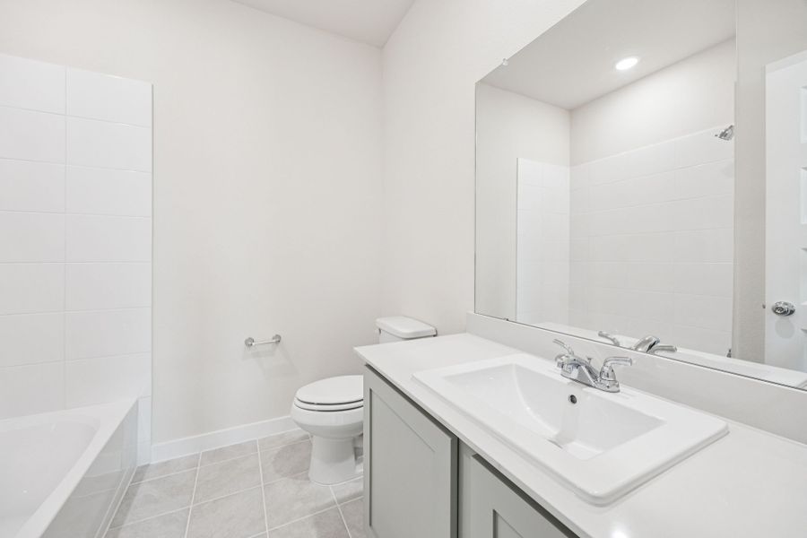 Bathroom in the Claret home plan by Trophy Signature Homes – REPRESENTATIVE PHOTO Bathroom in the Claret home plan by Trophy Signature Homes – REPRESENTATIVE PHOTO