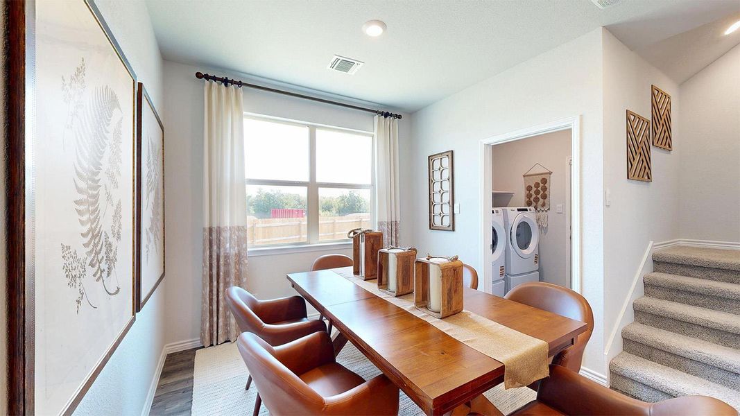 Dining space featuring independent washer and dryer, wood finished floors, and recessed lighting Dining space featuring independent washer and dryer, wood finished floors, and recessed lighting