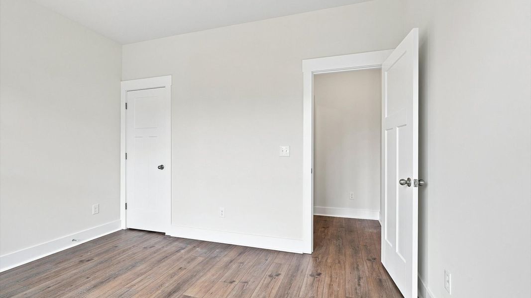 Superior hardwood flooring enhances the comfort and style of every secondary bedroom