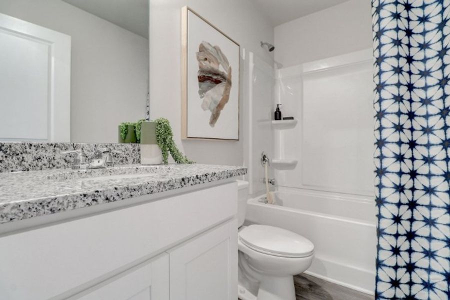 A bathroom with a marble countertop. A bathroom with a marble countertop.