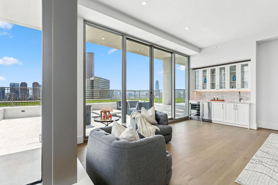 Walls of sliding doors open fully creating a seamless connection between inside and the outdoors Walls of sliding doors open fully creating a seamless connection between inside and the outdoors