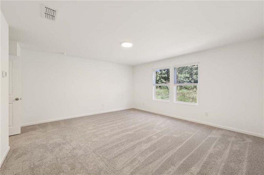 Spacious, unfurnished interior of a new home in Eastlyn Crossing, Flowery Branch (Image 23).