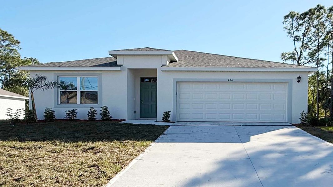 Front exterior of a new home in Palm Bay, Palm Bay, FL, highlighting curb appeal (Image 1). Front exterior of a new home in Palm Bay, Palm Bay, FL, highlighting curb appeal (Image 1).