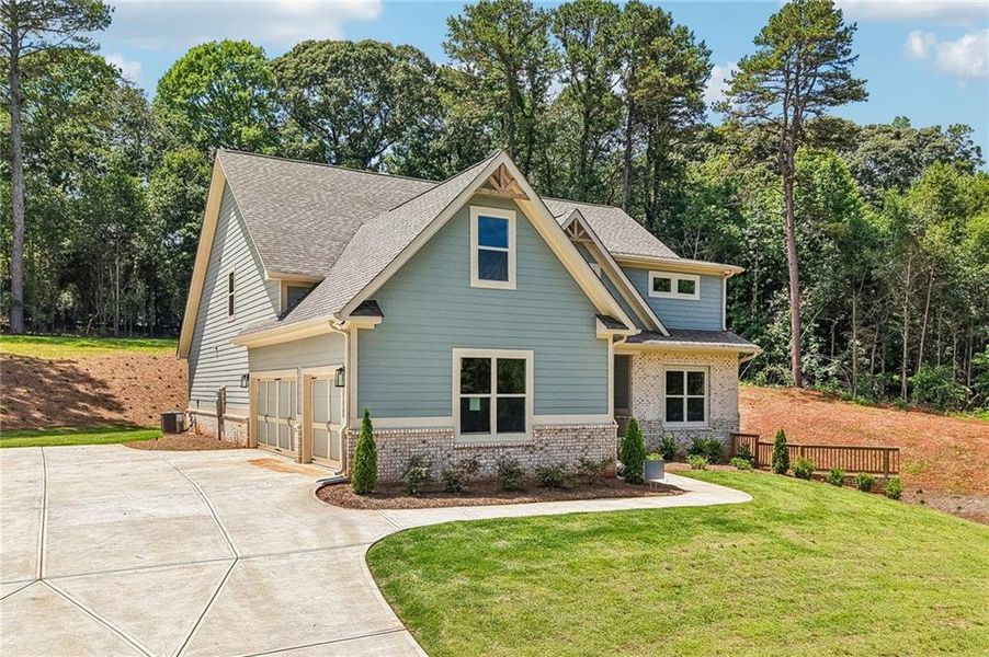 Front exterior of a new home in Steeplechase, Hoschton, GA, highlighting curb appeal (Image 27).