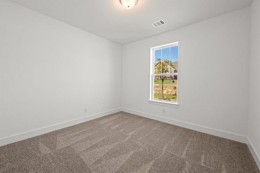 Third bedroom with carpet