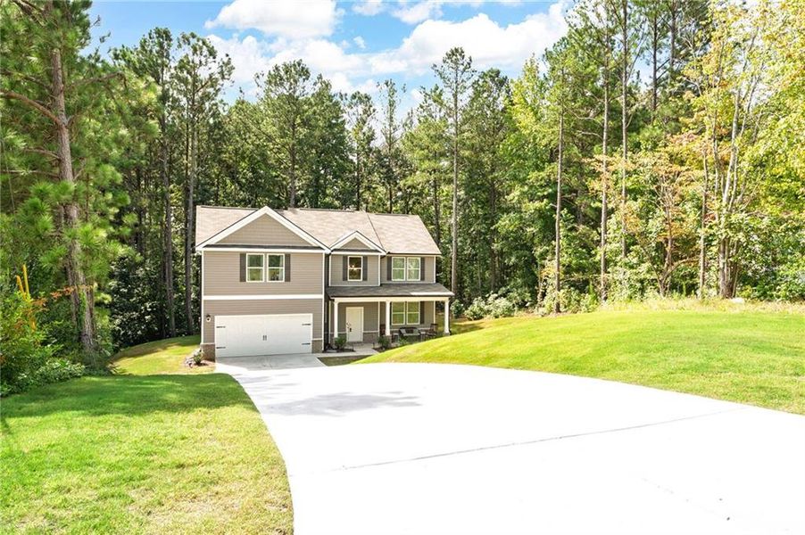 Front exterior of a new home in , Dallas, GA, highlighting curb appeal (Image 21).