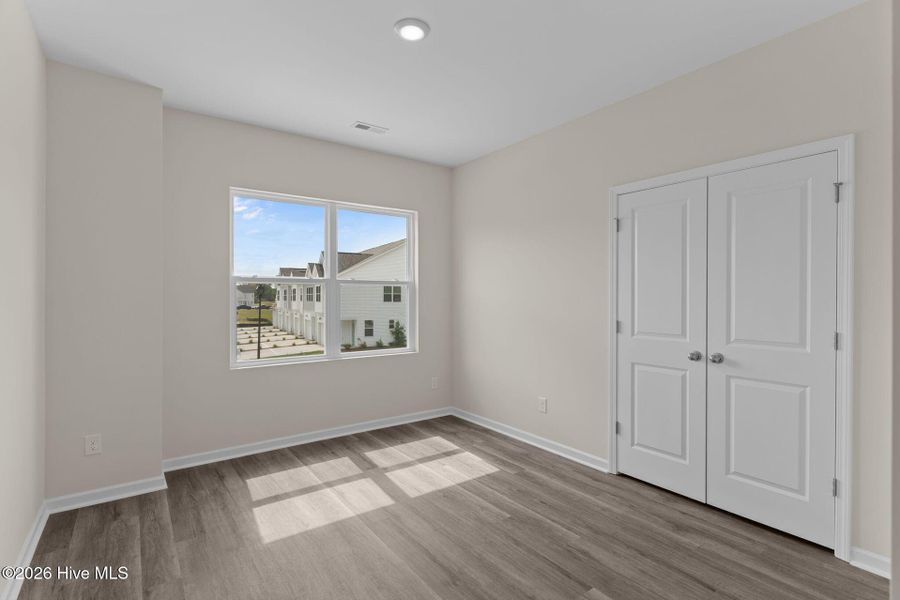 Spacious, unfurnished interior of a new home in Coastal Haven Townes, Leland (Image 11).