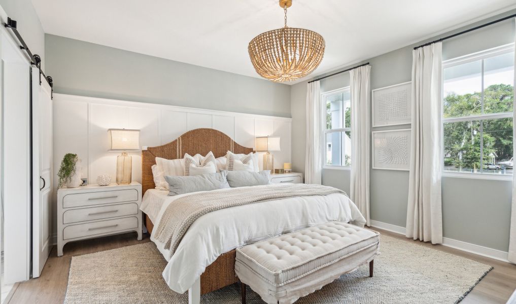 Primary suite with decorative feature wall Primary suite with decorative feature wall