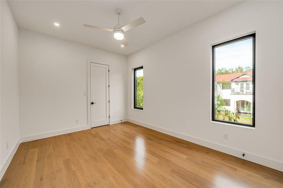 Spare room with light wood-style floors, recessed lighting, and ceiling fan Spare room with light wood-style floors, recessed lighting, and ceiling fan