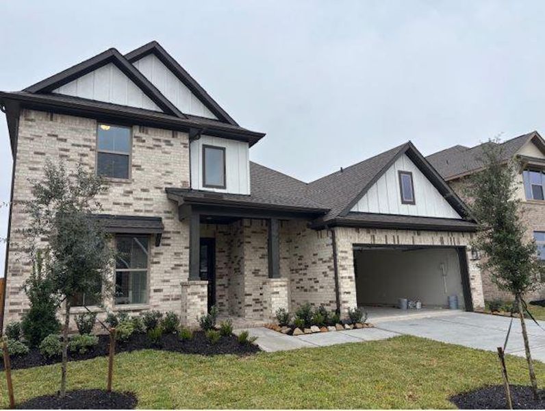 Front exterior of a new home in The Meadows at Imperial Oaks 60', Conroe, TX, highlighting curb appeal (Image 1). Front exterior of a new home in The Meadows at Imperial Oaks 60', Conroe, TX, highlighting curb appeal (Image 1).