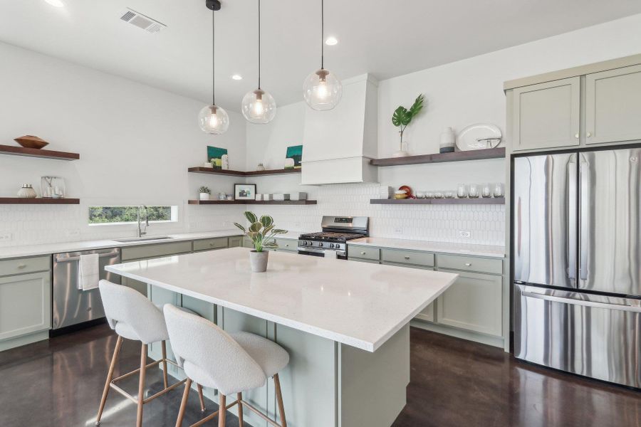 Kitchen with open shelves, appliances with stainless steel finishes, a sink, decorative backsplash, and recessed lighting Kitchen with open shelves, appliances with stainless steel finishes, a sink, decorative backsplash, and recessed lighting