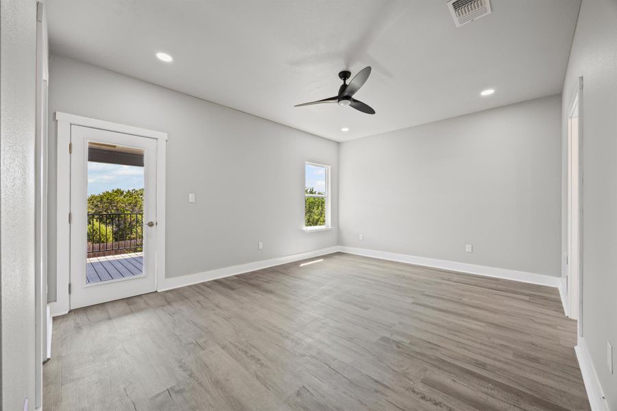 Unfurnished room with light wood-style floors, recessed lighting, and a ceiling fan Unfurnished room with light wood-style floors, recessed lighting, and a ceiling fan
