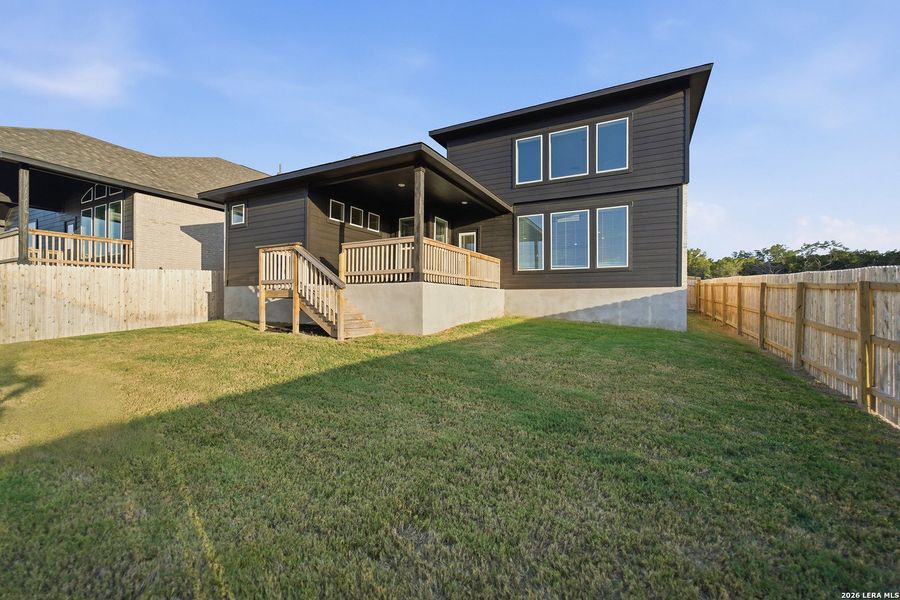 Exterior details and patio area of a home in The Woodlands at Medina Hills, Mico (Image 25).
