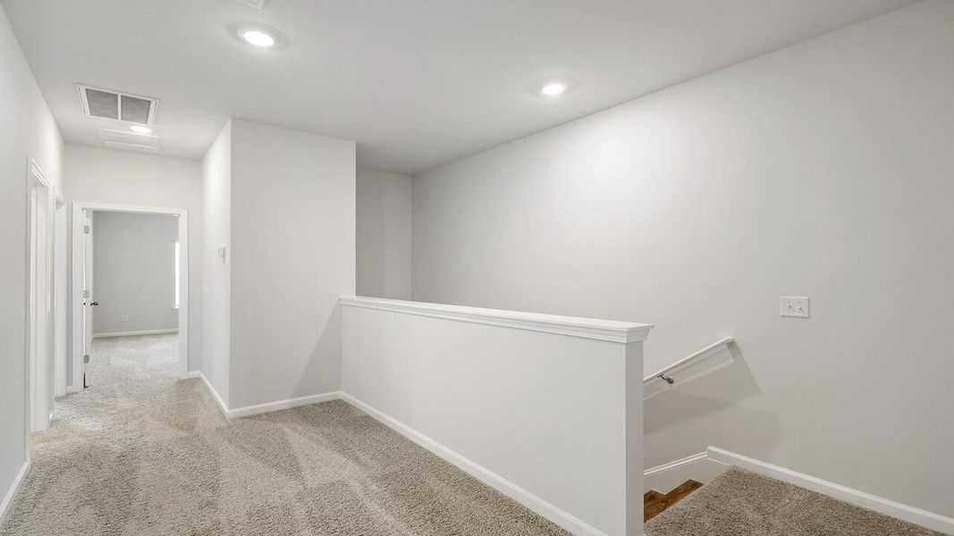 Spacious, unfurnished interior of a new home in The Crossing at St. James, Summerville (Image 16).
