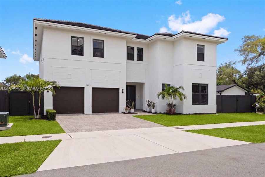 Front exterior of a new home in , Palmetto Bay, FL, highlighting curb appeal (Image 2). Front exterior of a new home in , Palmetto Bay, FL, highlighting curb appeal (Image 2).