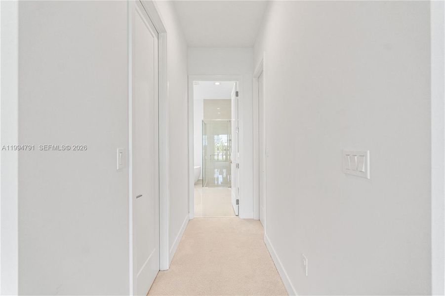 Two walk-in closets in hallway to ensuite bath