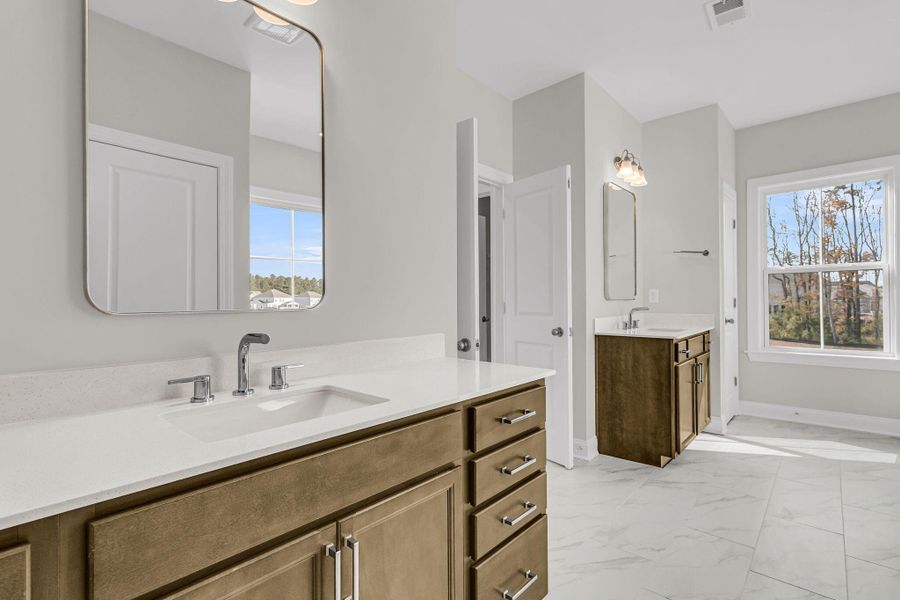 Furnished interior view inside a new home in Tidewater at Lakes of Cane Bay, Summerville (Image 17). Furnished interior view inside a new home in Tidewater at Lakes of Cane Bay, Summerville (Image 17).