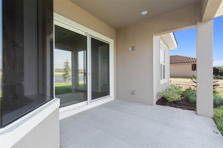 Front exterior of a new home in Marina Del Palma, Palm Coast, FL, highlighting curb appeal (Image 25).