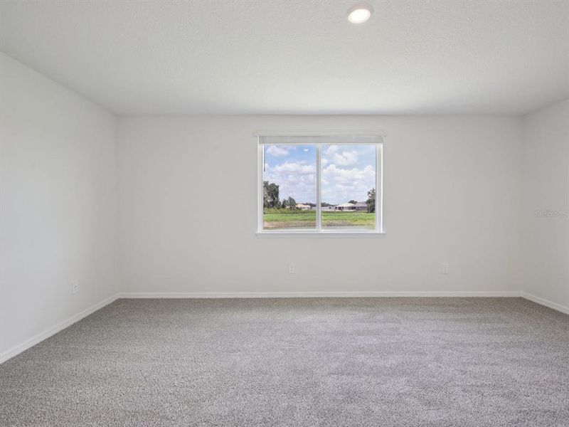 Spacious, unfurnished interior of a new home in Oakfield Trails - Signature Series, Parrish (Image 6).