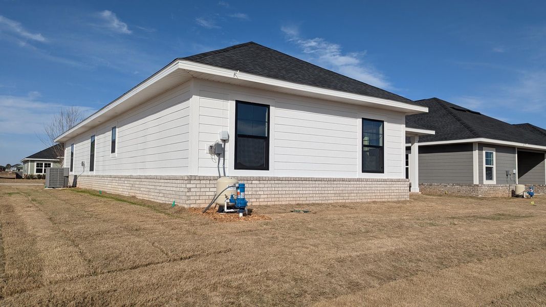 Front exterior of a new home in The Bluffs at Lafayette, Freeport, FL, highlighting curb appeal (Image 2).