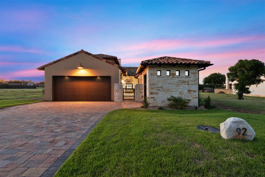 Gorgeous Mediterranean hill country contemporary home with paved driveway & .25 acre private lot with coveted, North facing views of the #14 hole.