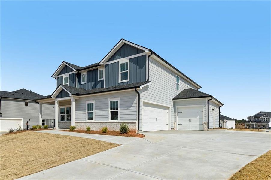 Front exterior of a new home in River Pointe, Monroe, GA, highlighting curb appeal (Image 27).