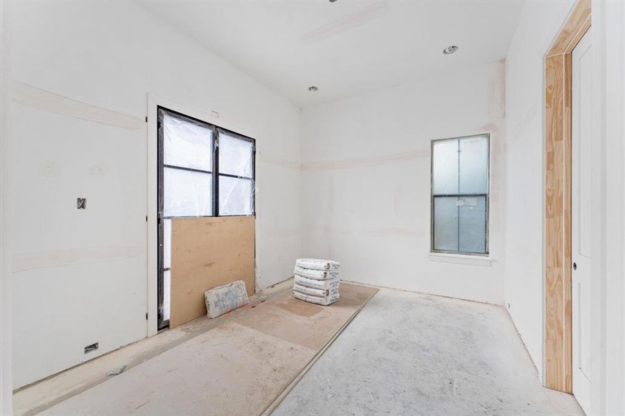 Adjacent to the foyer, you'll find the study/optional bedroom with bath showcasing a Chevron pattern of European oak engineered hardwood floors. Steel French doors open to an inviting 10 ft front patio surrounded by a 3 ft brick wall—a great outdoor area to enjoy!