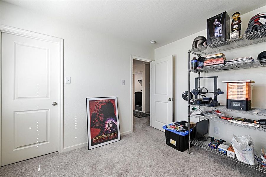 Carpeted office space with baseboards Carpeted office space with baseboards