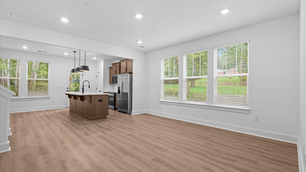 Hardwood flooring and high standards define this vibrant family room ideal for everyday living Hardwood flooring and high standards define this vibrant family room ideal for everyday living