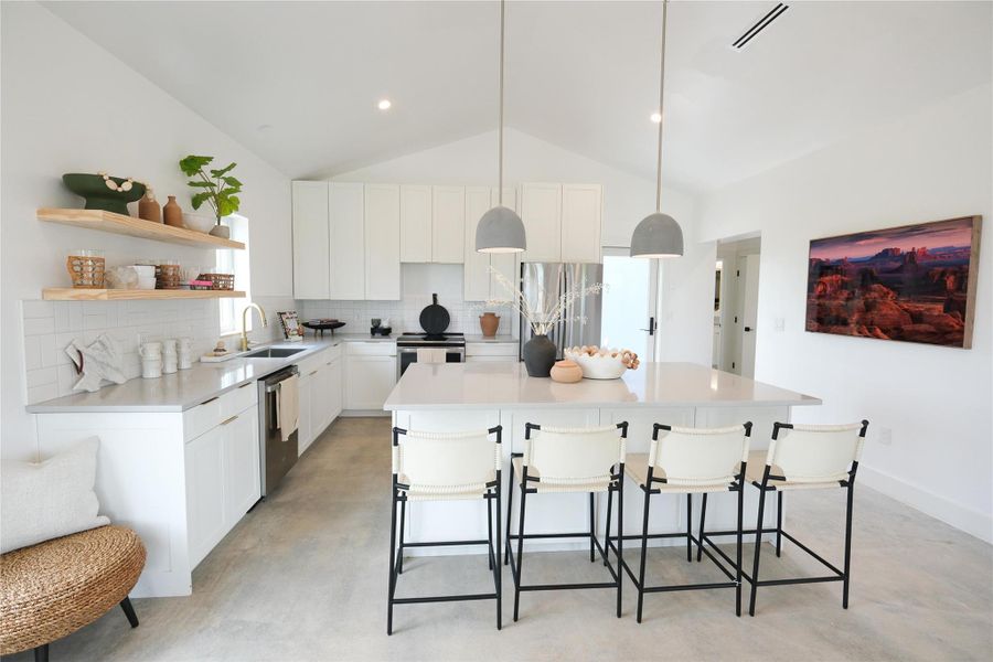 Open Concept Floorplan, with vaulted ceilings, flooded with natural light. Offering minimalistic yet high-end finishes through out the entire Hacienda.