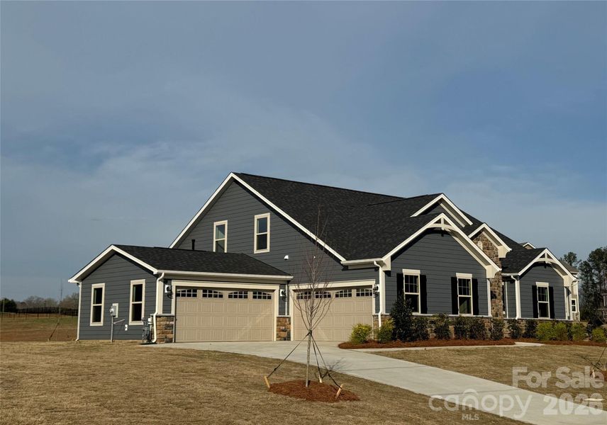 Front exterior of a new home in Blair Place, Monroe, NC, highlighting curb appeal (Image 16).