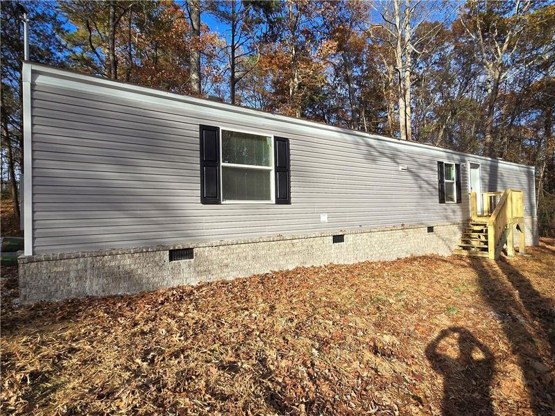 Exterior details and patio area of a home in , Ellijay (Image 1).