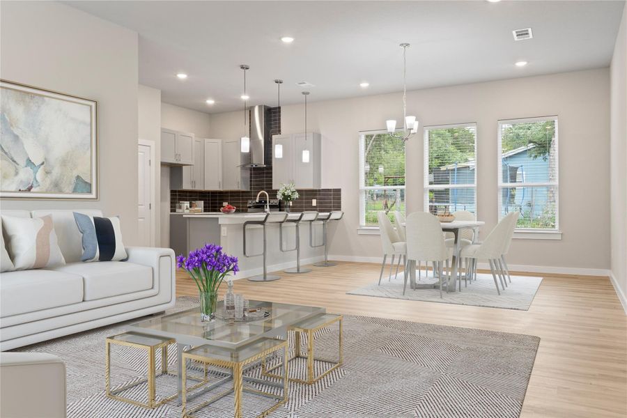 A stunning living room with an open floor plan, seamlessly flowing into the dining area and cozy kitchen (virtually staged). A stunning living room with an open floor plan, seamlessly flowing into the dining area and cozy kitchen (virtually staged).