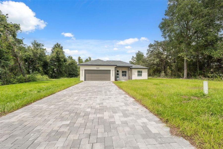 Front exterior of a new home in , Ocala, FL, highlighting curb appeal (Image 1).