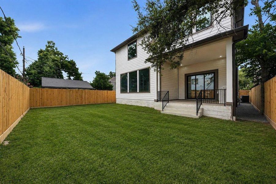 Oversized yard with plenty of room for a pool and sight-lines into the outdoor patio and kitchen