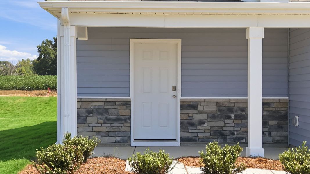 Exterior details and patio area of a home in Hobbs Farm, Ayden (Image 3).