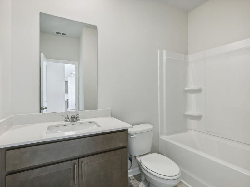 Furnished interior view inside a new home in Northwoods at Mirror Lake, Villa Rica (Image 6).