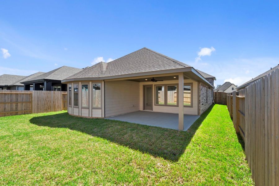 Exterior details and patio area of a home in Grand Central Park, Conroe (Image 23).