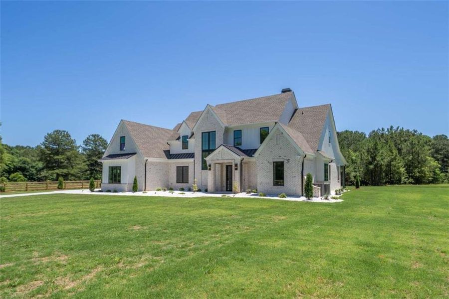 Front exterior of a new home in , Monroe, GA, highlighting curb appeal (Image 29).