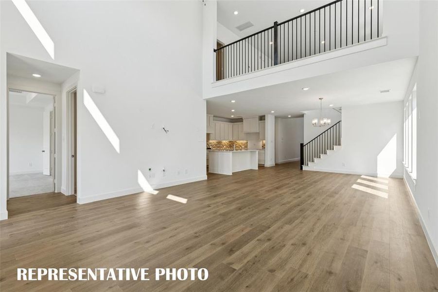 With the game room open to the living room, you'll find multi-level entertainment in this dream home!  REPRESENTATIVE PHOTO