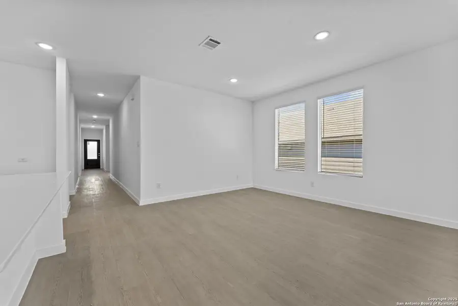Spacious, unfurnished interior of a new home in Waterwheel: Coastline Collection, San Antonio (Image 11).