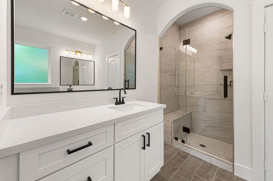 Stunning black fixtures throughout.
